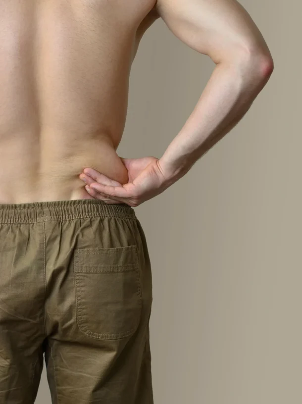 rear-view-shirtless-man-standing-against-white-background (1)